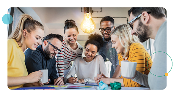 Employees sitting around a table